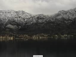 Risan waterfront and mountains in a quiet winter view