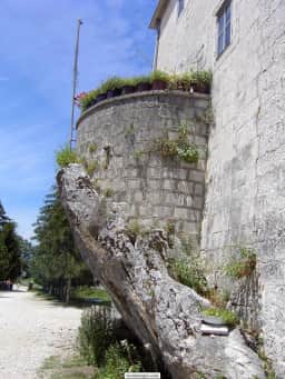 Narrow stone balcony and arches at the Upper Ostrog Monastery