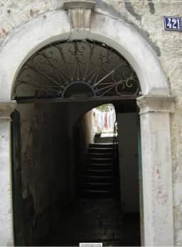Arched passage and stairway inside Kotor’s historic urban fabric