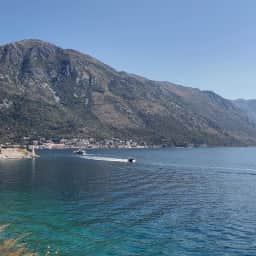 The village shoreline at Kamenari with the strait beyond it.