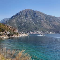 Turquoise shallow water beside the coastal road at Kamenari.