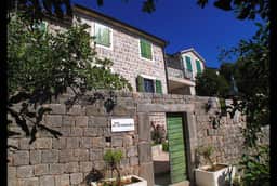 Stone entrance and green shutters at Klinci Village Resort in the 2014 gallery