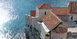 Citadel rooflines and walls above the Adriatic