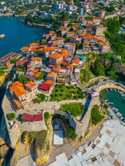 Aerial view of the compact stone fabric of Ulcinj Old Town and fortress