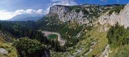 High Durmitor cliffs, forest and a glacial lake seen from above