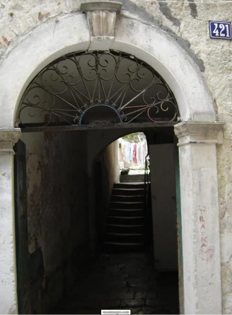 Historic stone gateway and narrow passage in Kotor Old Town