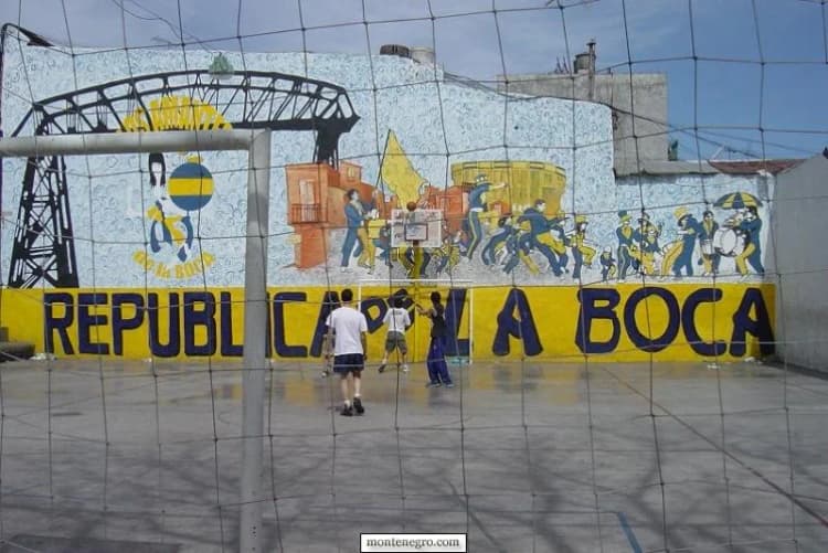 Boca Juniors mural beside a football court in La Boca