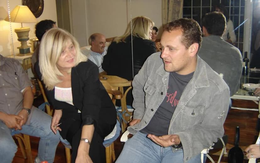 Two participants speaking during an archival Montenegro.com diaspora gathering in Argentina