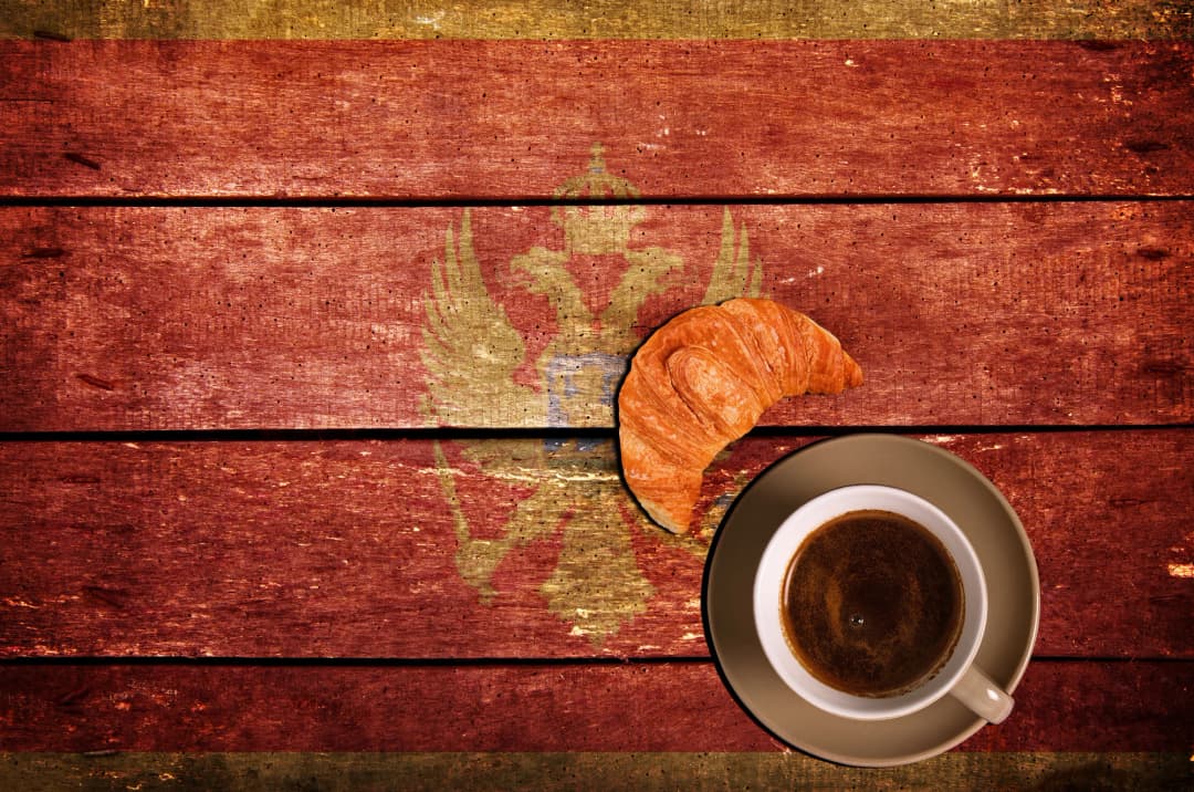 A café table set with pastries and coffee