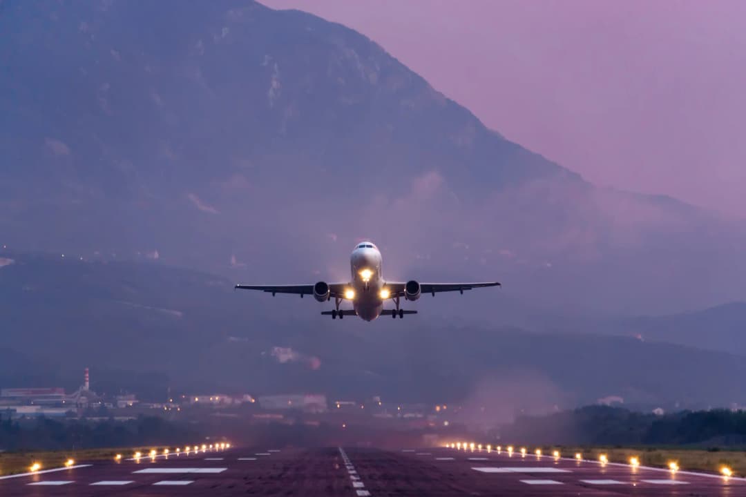 Tivat Airport seen with its runway and terminal area hemmed in by the mountains ringing the Bay of Kotor