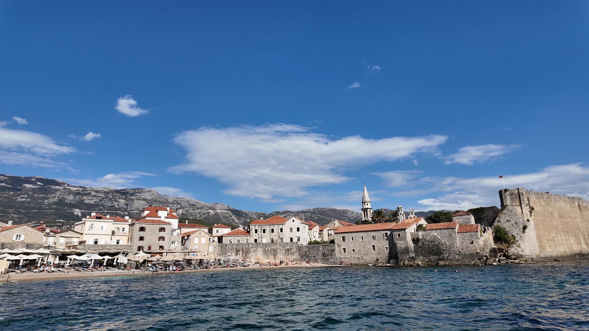 The walls of Budva Old Town and the bell tower of St John, seen across the water from Ričardova glava