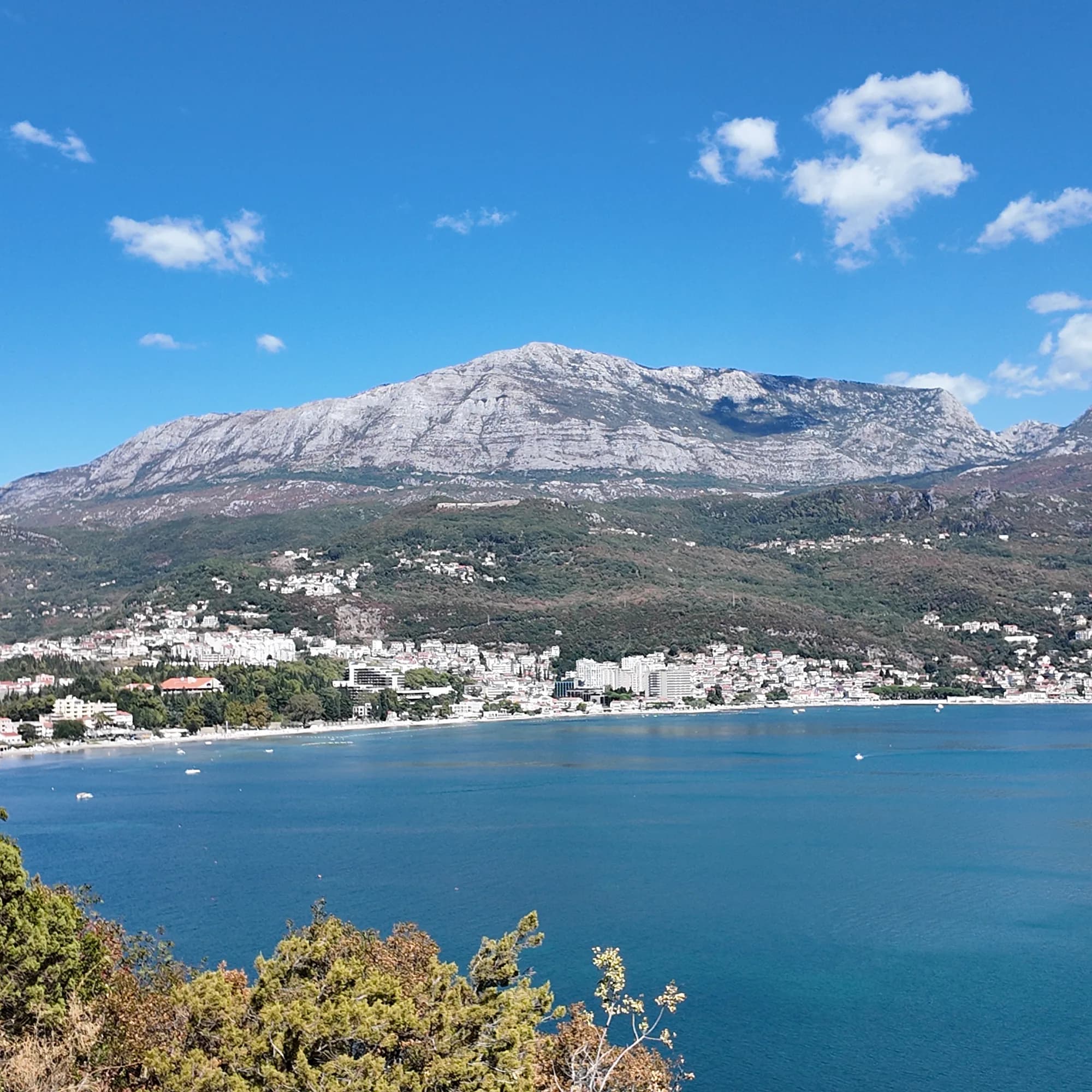 Igalo and its beach under the Orjen massif, seen across the bay from the Njivice road