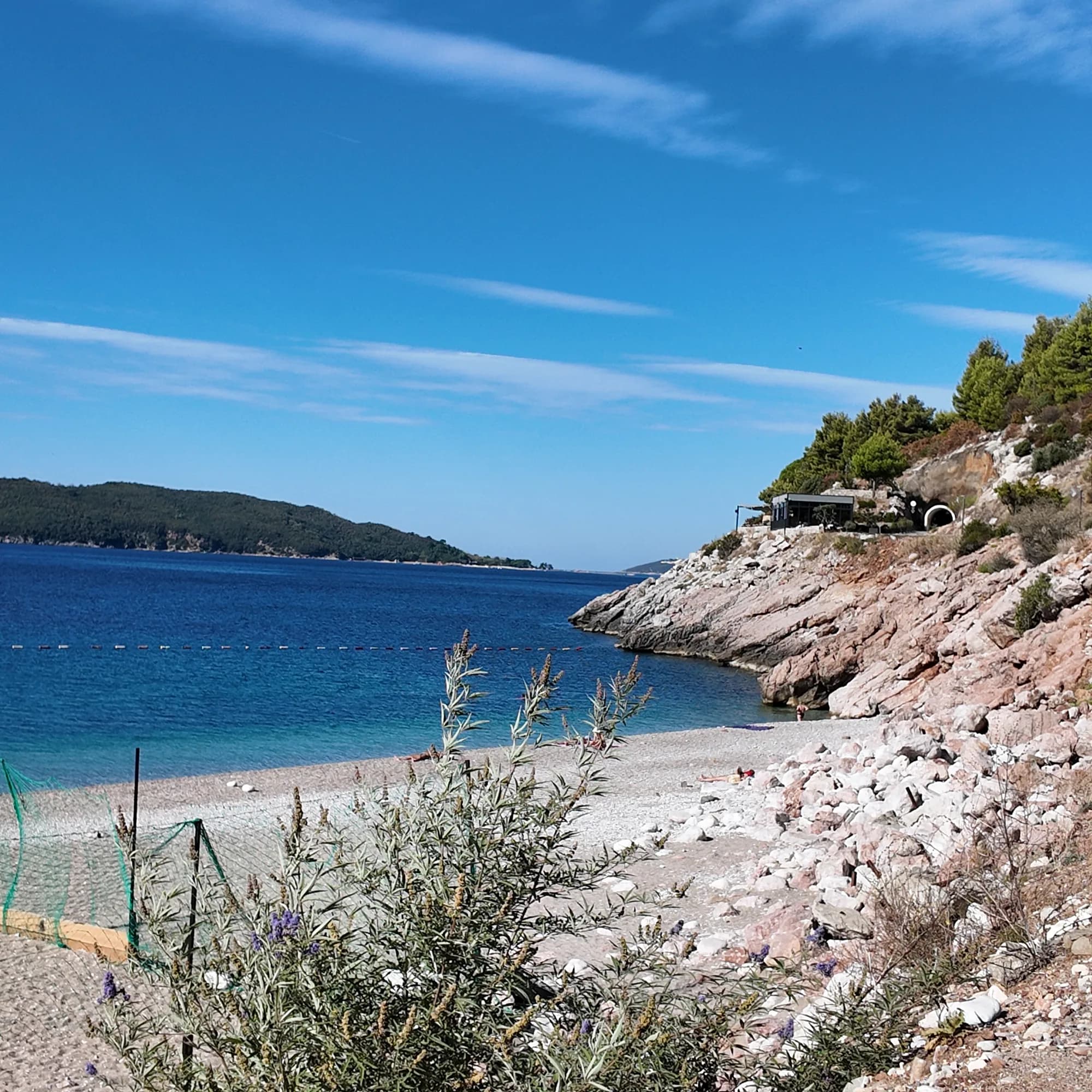 Boulders in clear shallow water at the rocky western end of Kamenovo