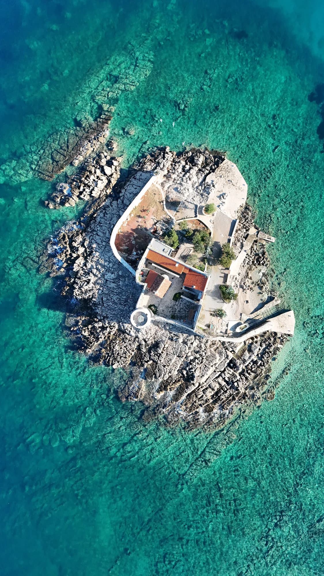 The circular island fort of Mamula from the air, in the bay mouth off the Luštica shore