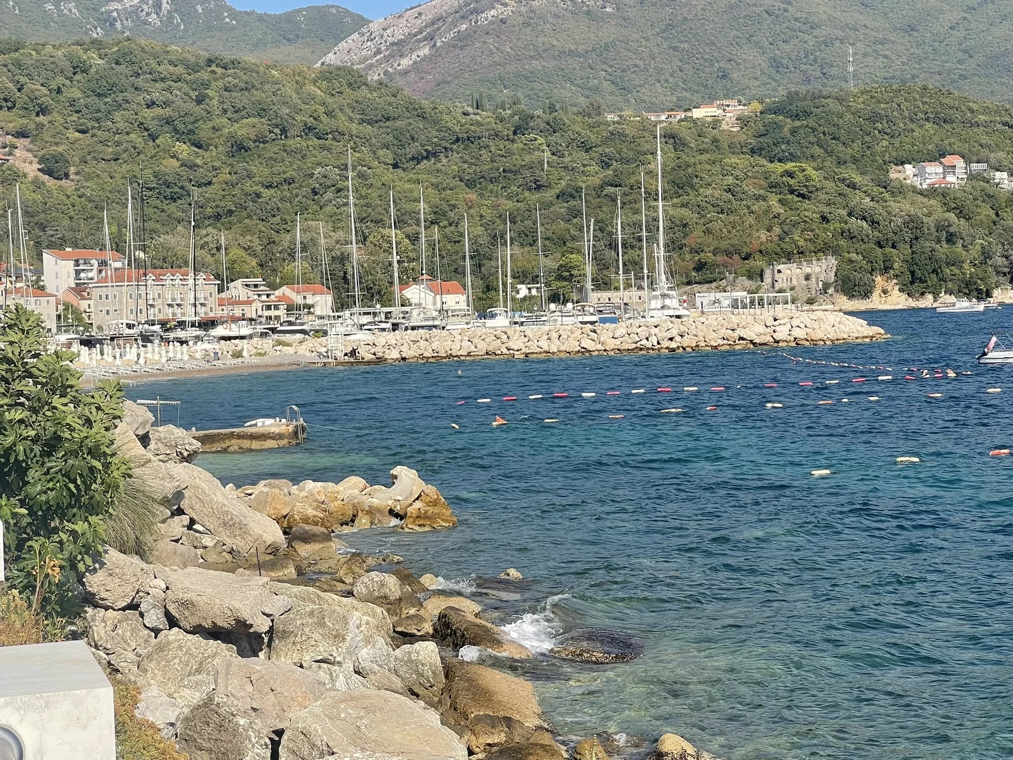 The Meljine shoreline looking toward the public beach and Lazure marina breakwater