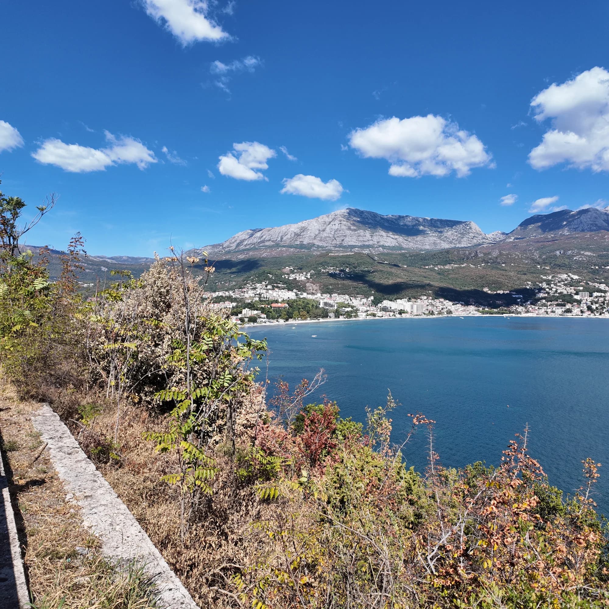 The Njivice shore looking north-east across the water to Herceg Novi and Igalo