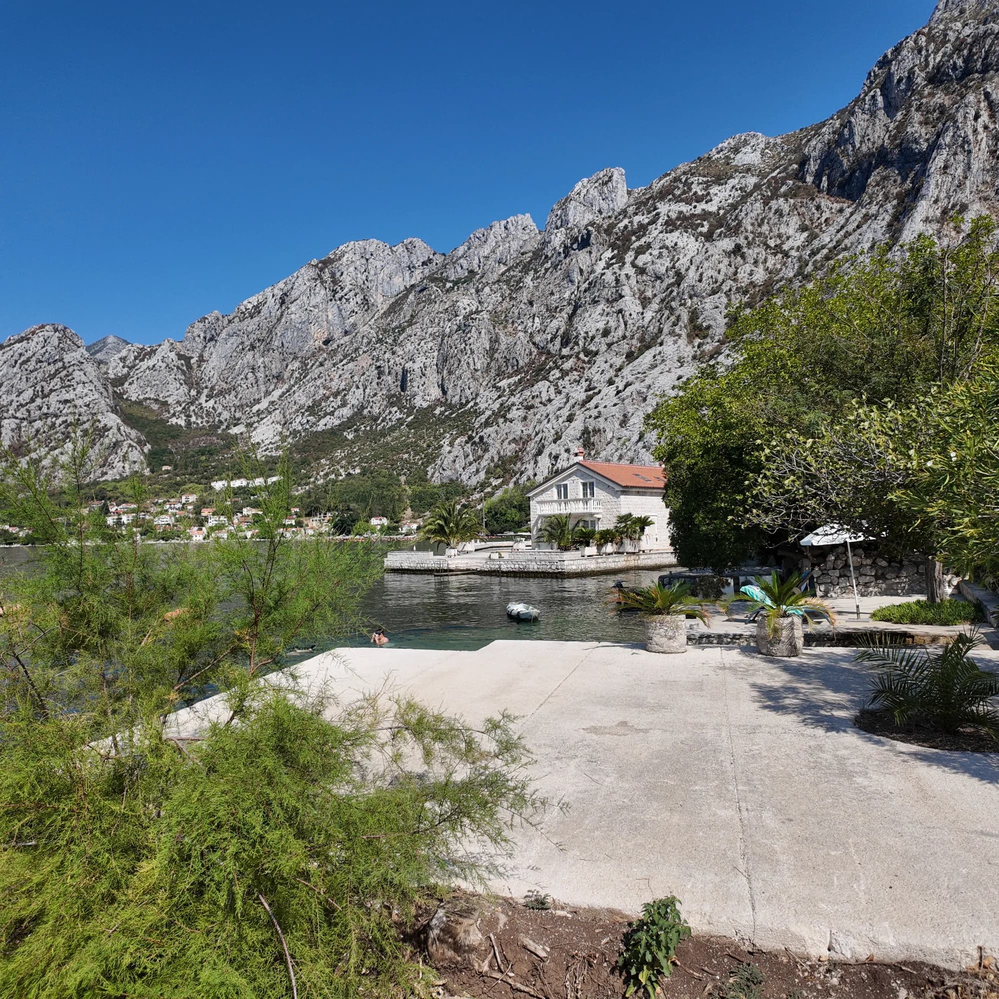 The quay and terrace of a shore house at Orahovac