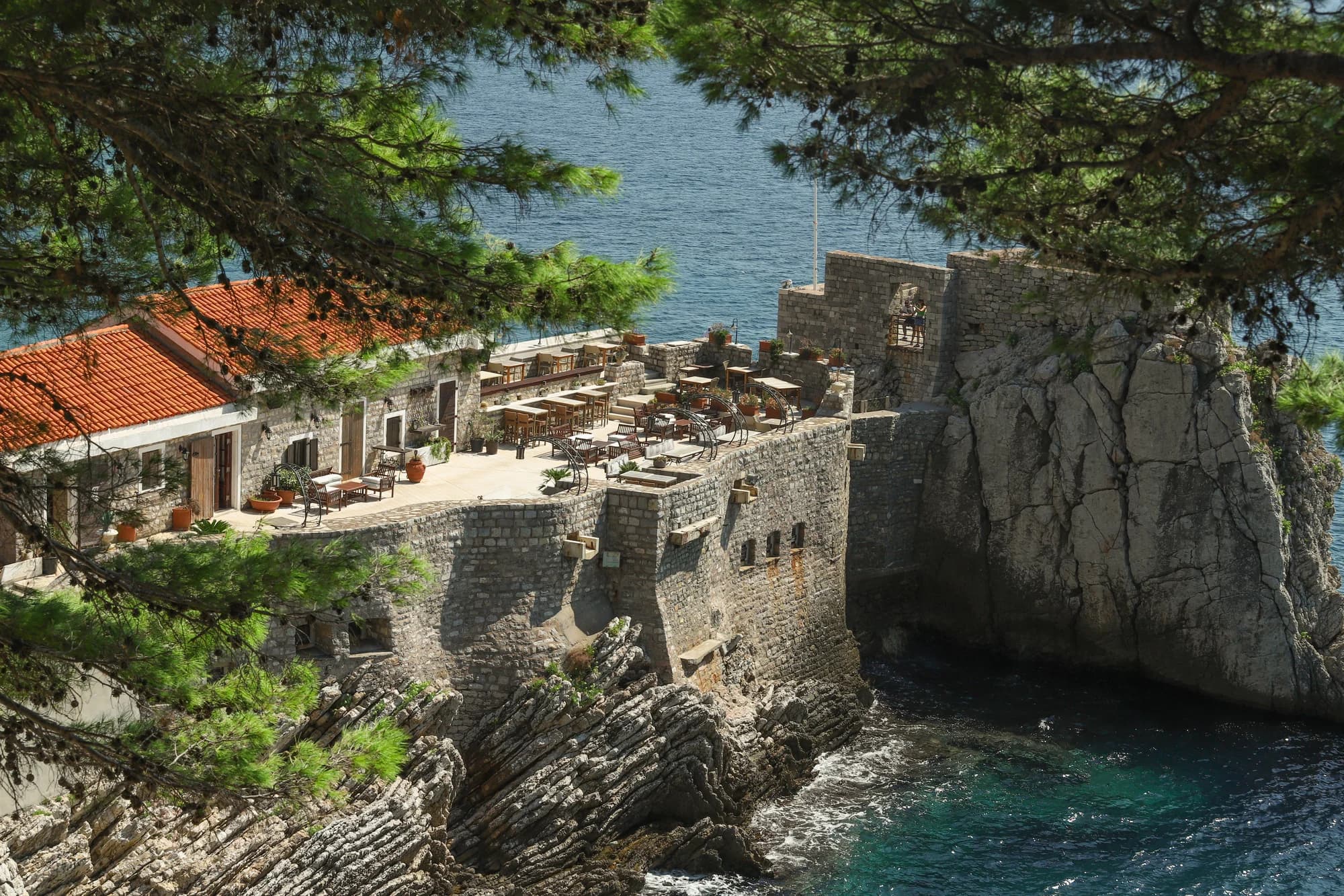 Stone ruins under the pines on the Petrovac coastal path