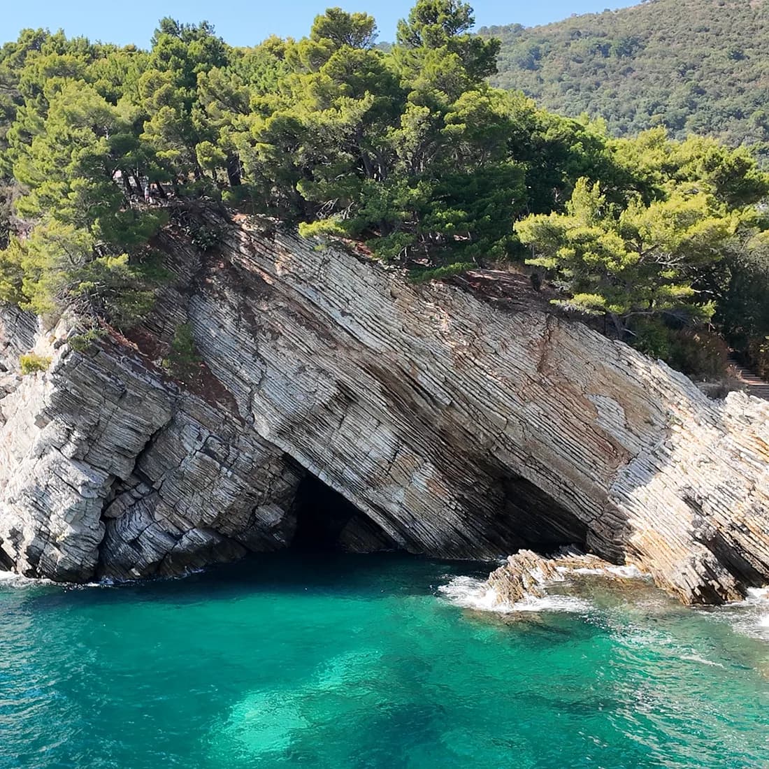 Turquoise water under the cliffs of the headlands south of Petrovac