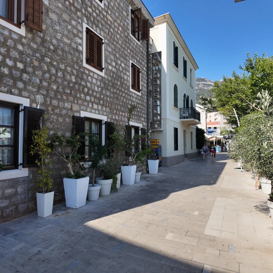 A narrow stone-paved lane between old buildings in Petrovac.