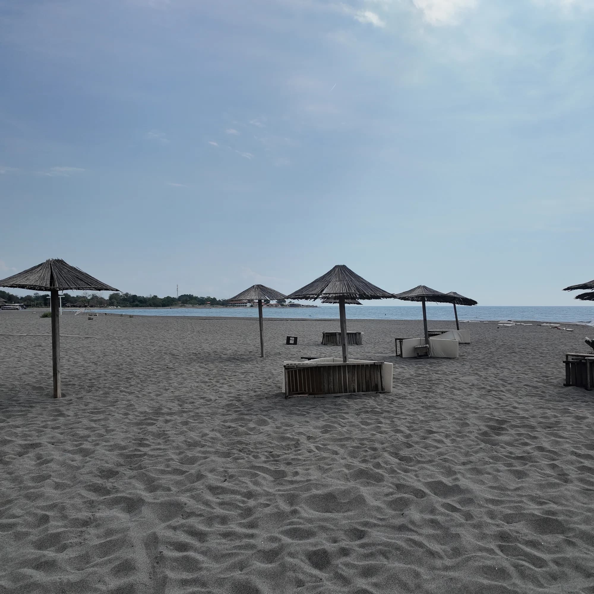 Umbrellas on the sand at Ada Bojana, folded on a quiet September day