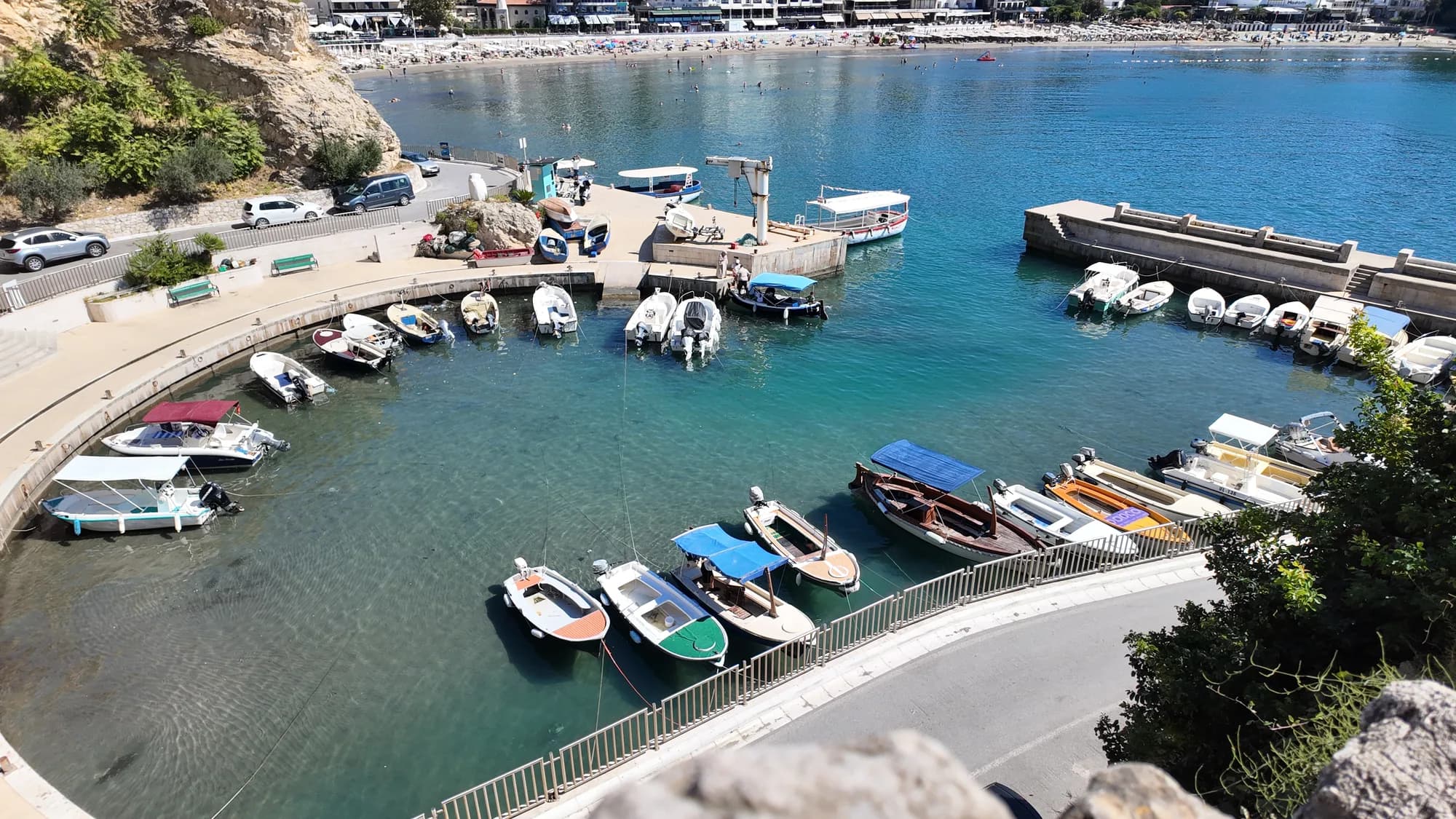 Small boats moored in the fishing harbour under the Old Town, seen from the walls