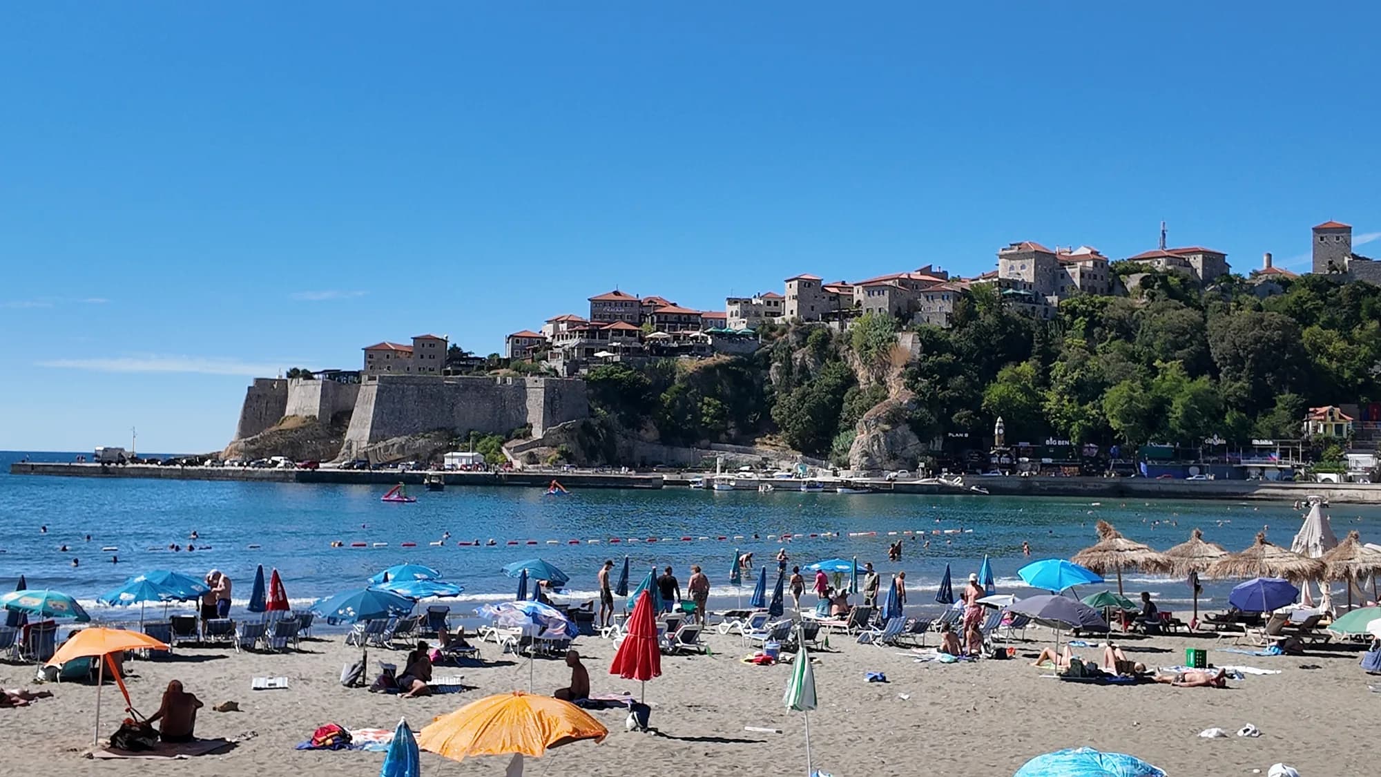Mala plaža in September, with the Kalaja walls and the Old Town on the rock above the sand