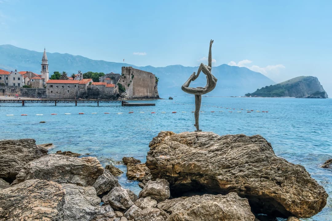 Waves breaking below the walls of Budva's Old Town.