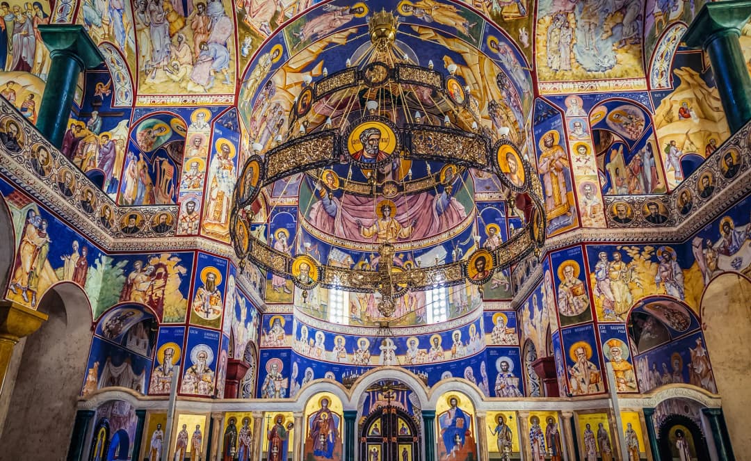 Fully frescoed interior of the Cathedral of Saint Jovan Vladimir with gilded chandelier