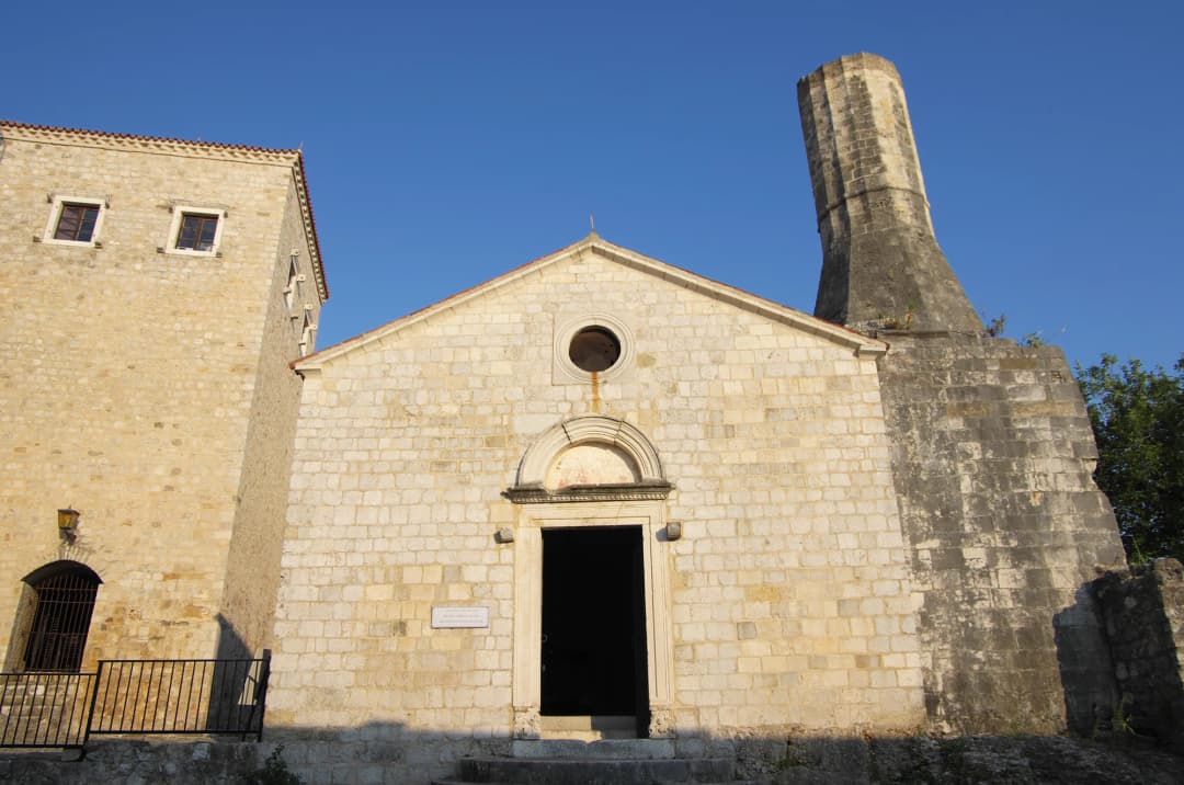 The Church-Mosque of Ulcinj, a stone building whose Christian nave and later minaret sit together above the Old Town.