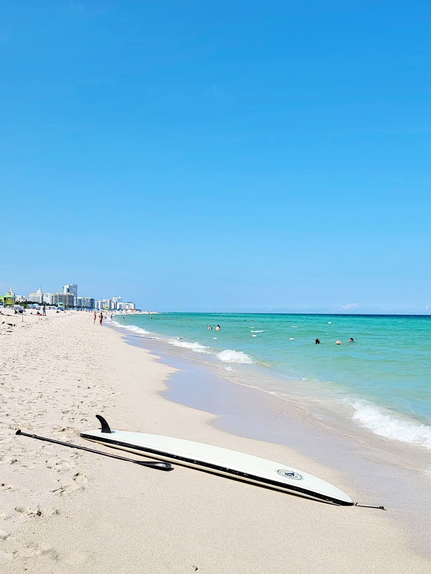 South Beach shoreline with a paddleboard and the Miami Beach skyline