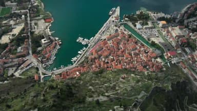 Kotor Old Town and its mountain fortifications beside the bay