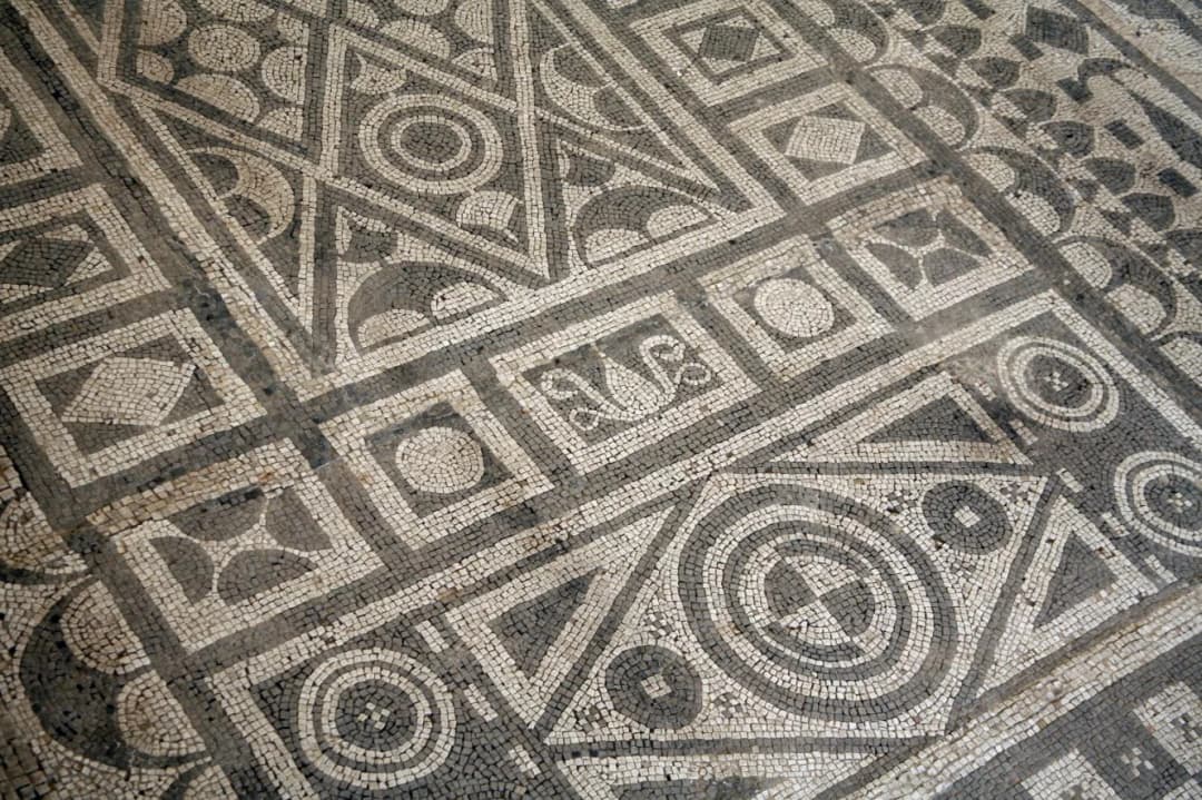Geometric black-and-white mosaic floor at the Roman Mosaics site in Risan