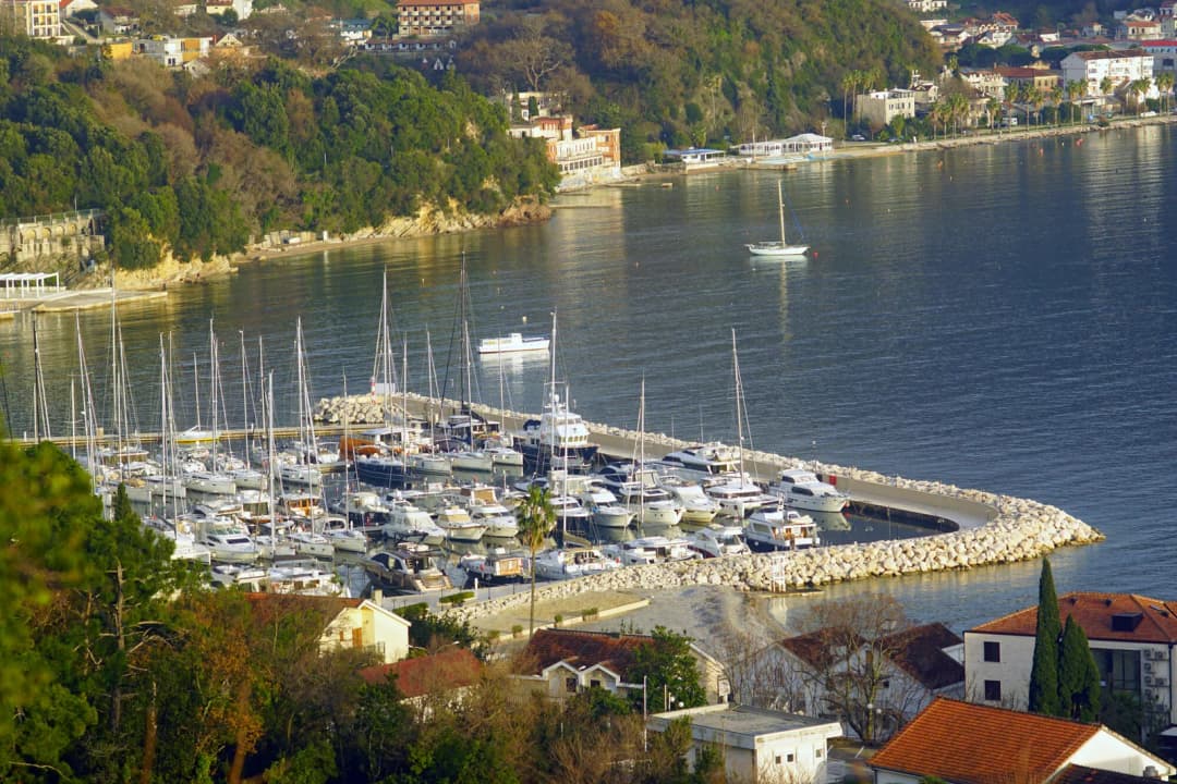Sailing yachts moored side by side at the pontoons of Zelenika marina in the Bay of Kotor