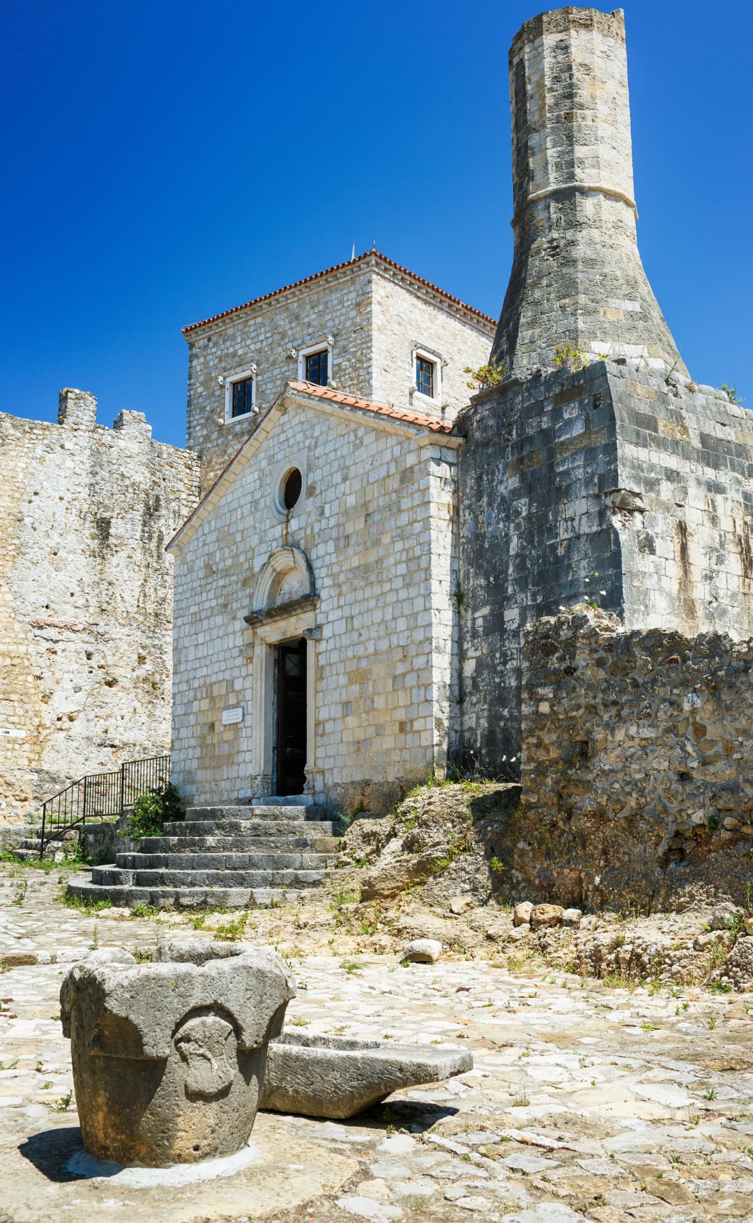 The truncated Ottoman minaret grafted onto the stone church of St Mary in Ulcinj's old town