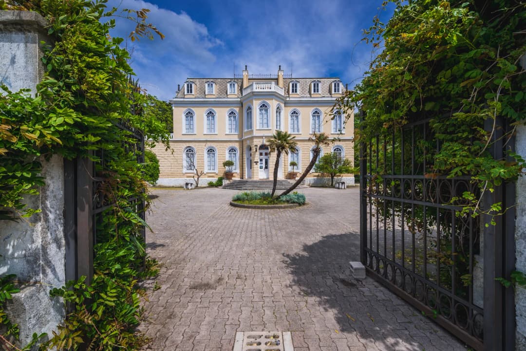 View through the wrought-iron gate into the palm garden of King Nikola's palace