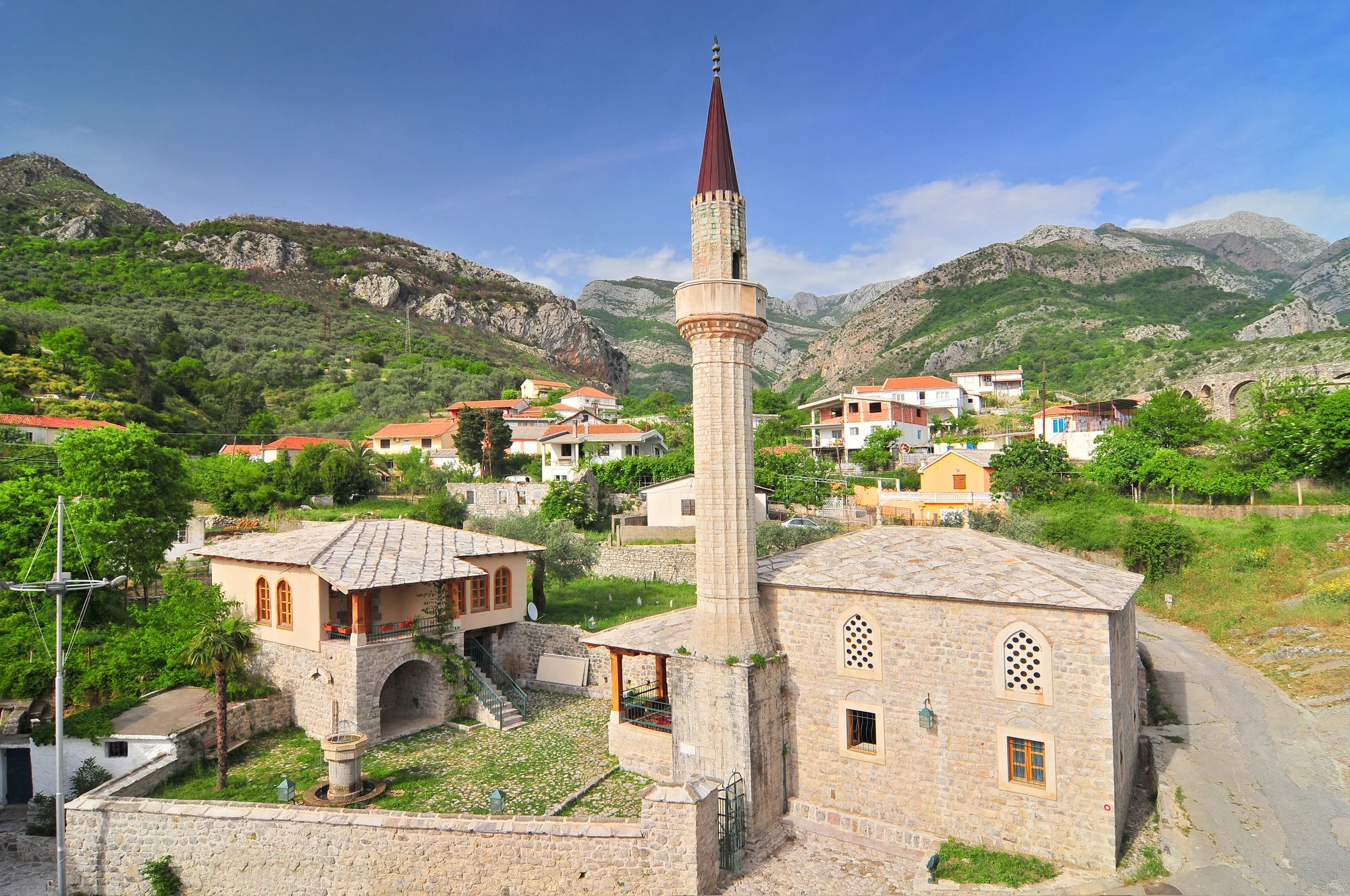 The old stone town of Bar on Montenegro's southern coast, its ruined walls set against the hills.
