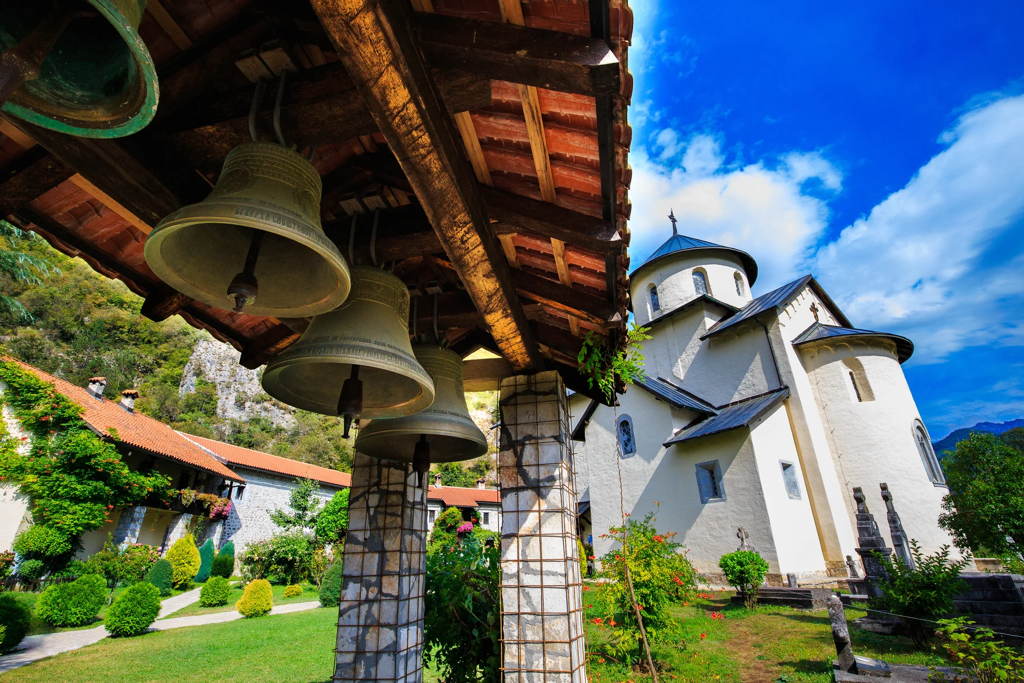 The mountain town of Kolasin in northern Montenegro, its houses backed by high wooded ridges.