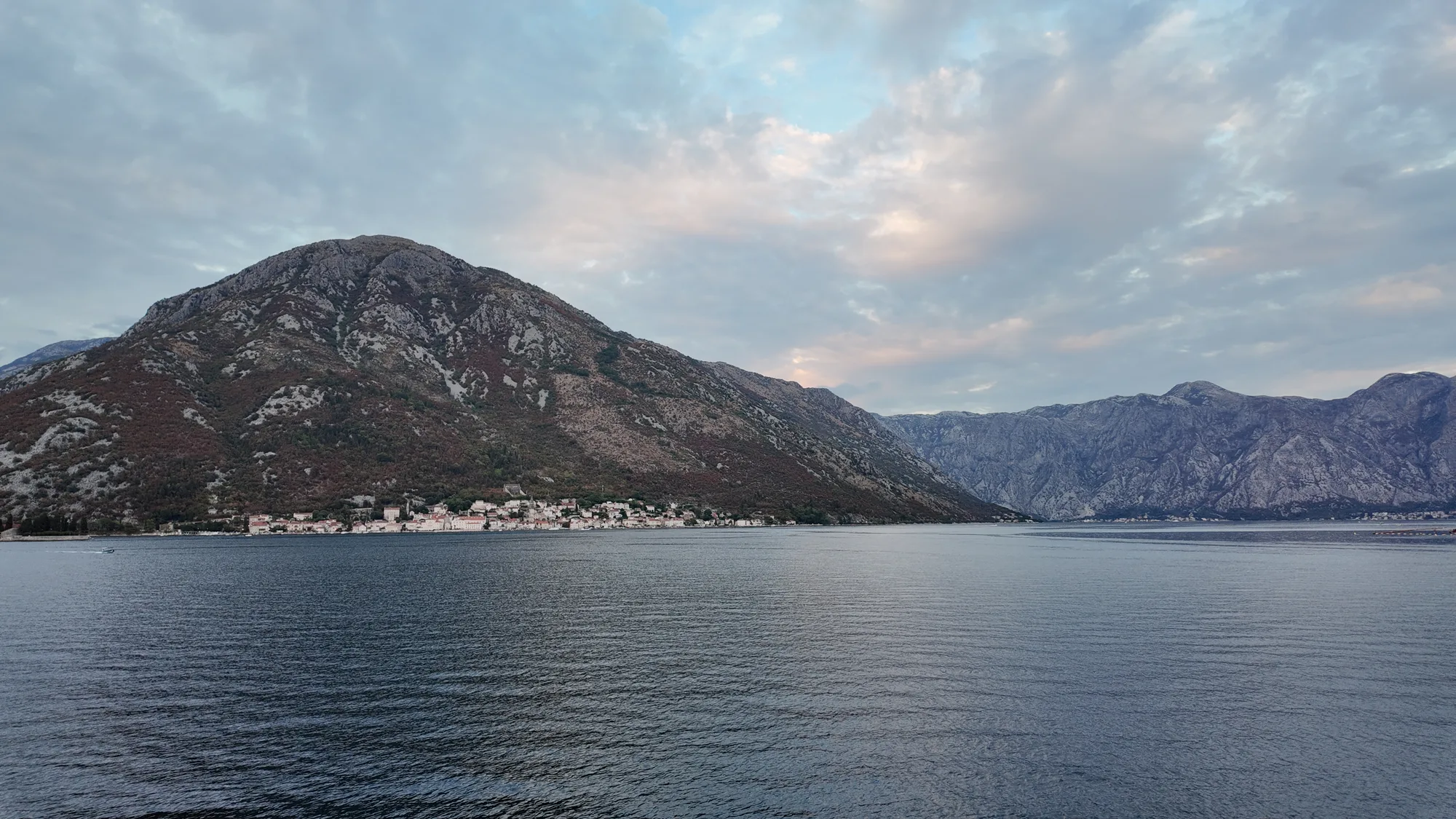 Perast at evening from Kostanjica, the mountain above the town catching the last light