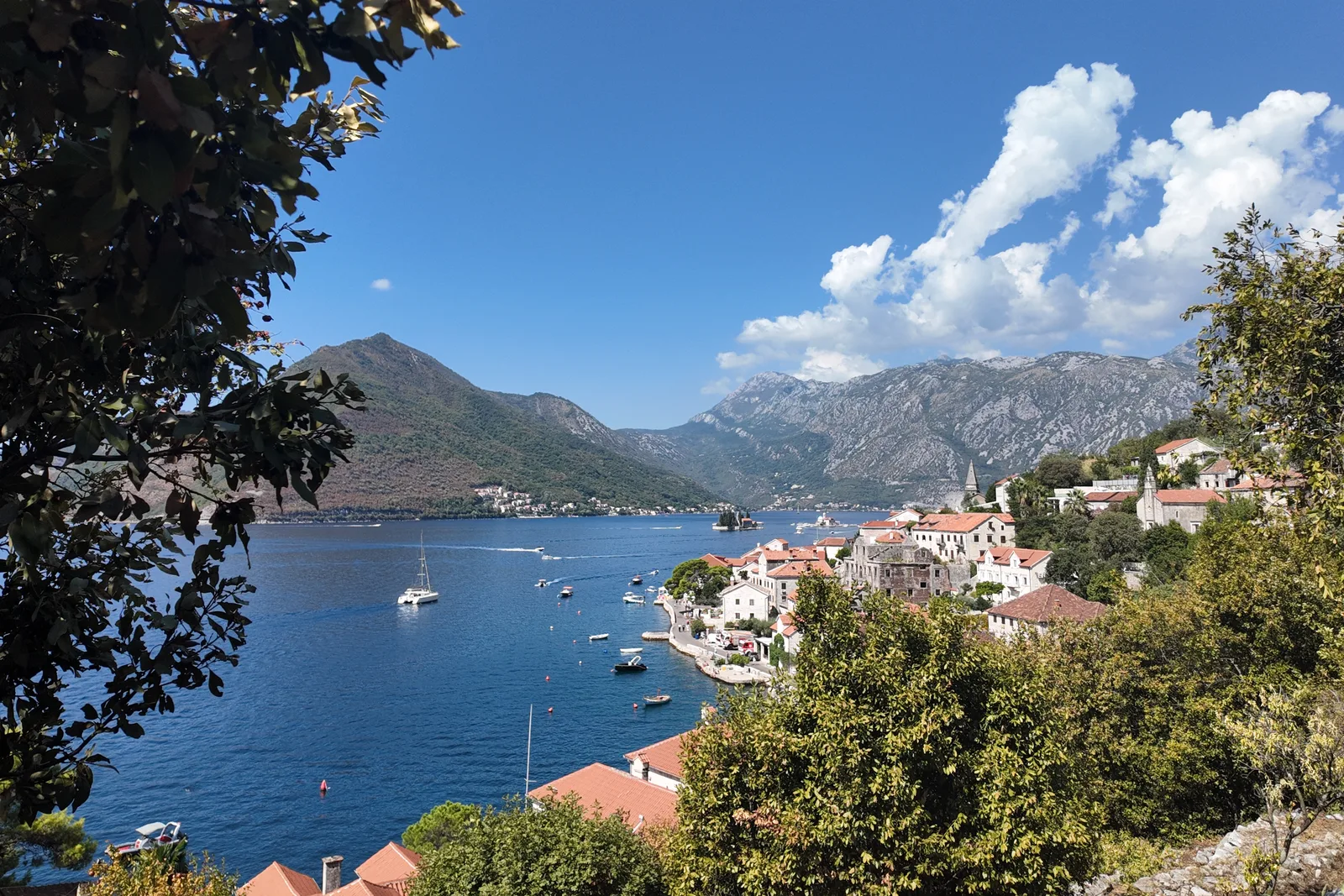 Perast and the Bay of Kotor, Montenegro, with the islet of St George and the surrounding mountains on a clear summer day