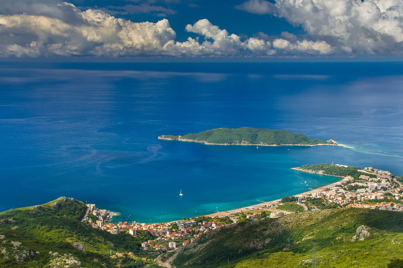 Elevated view of Becici and Rafailovici beach with Sveti Nikola island offshore