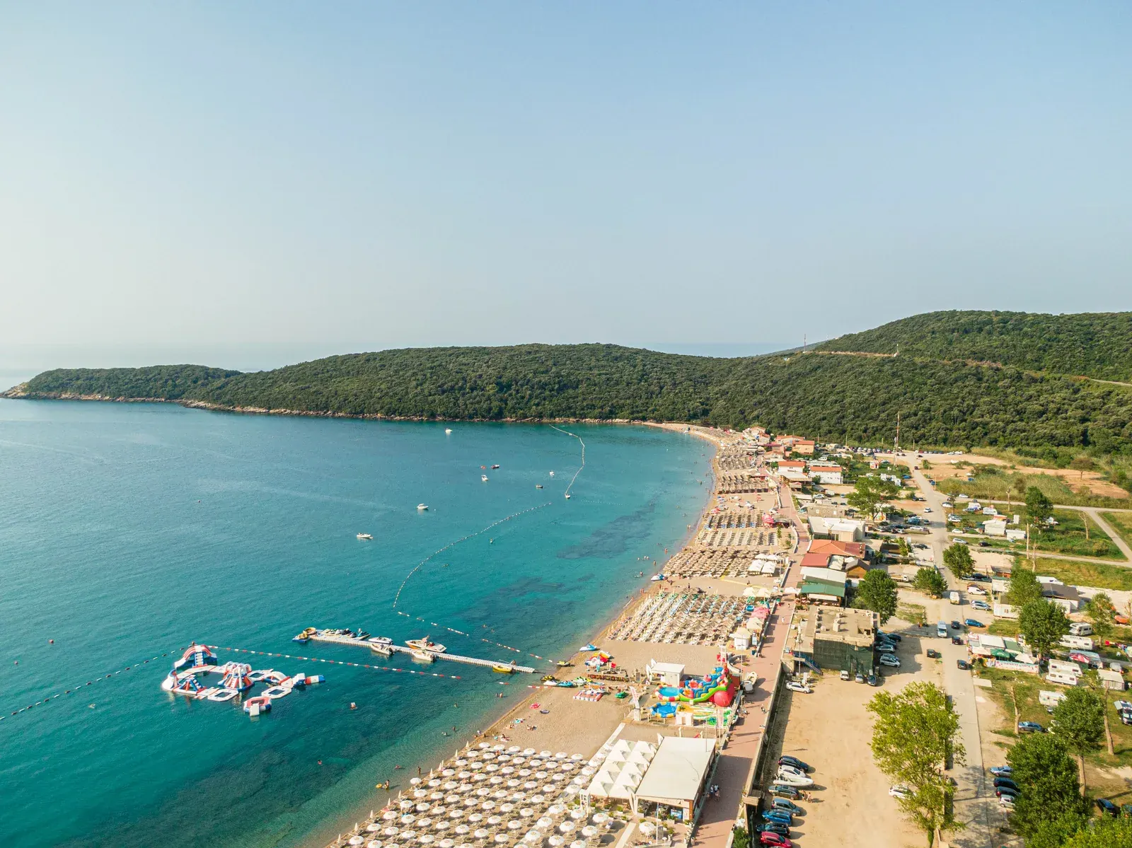 Jaz beach near Budva, the wide crescent of shore and open field behind it where the Sea Dance Festival is staged