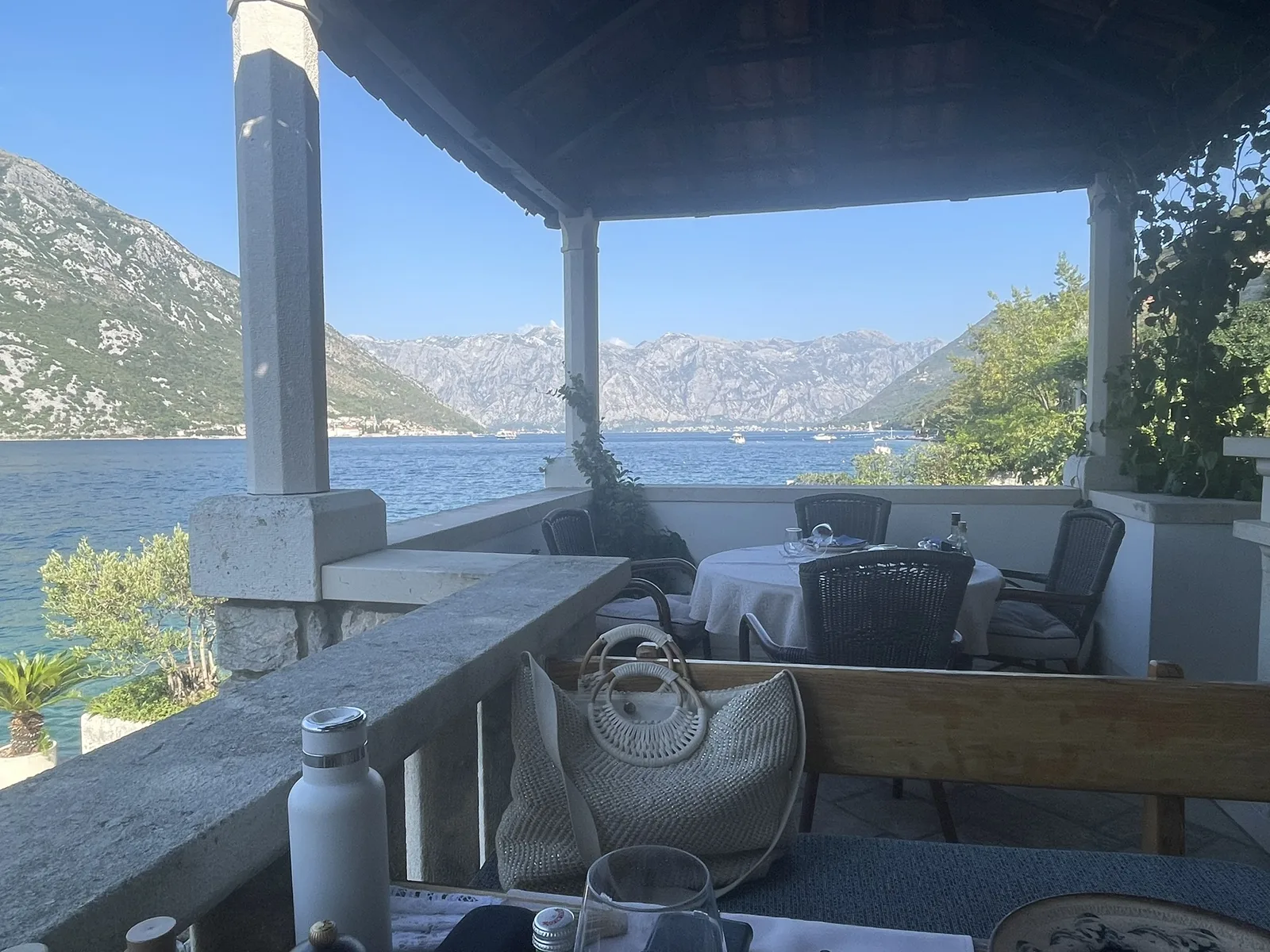 A covered stone terrace built out over the water at Kostanjica