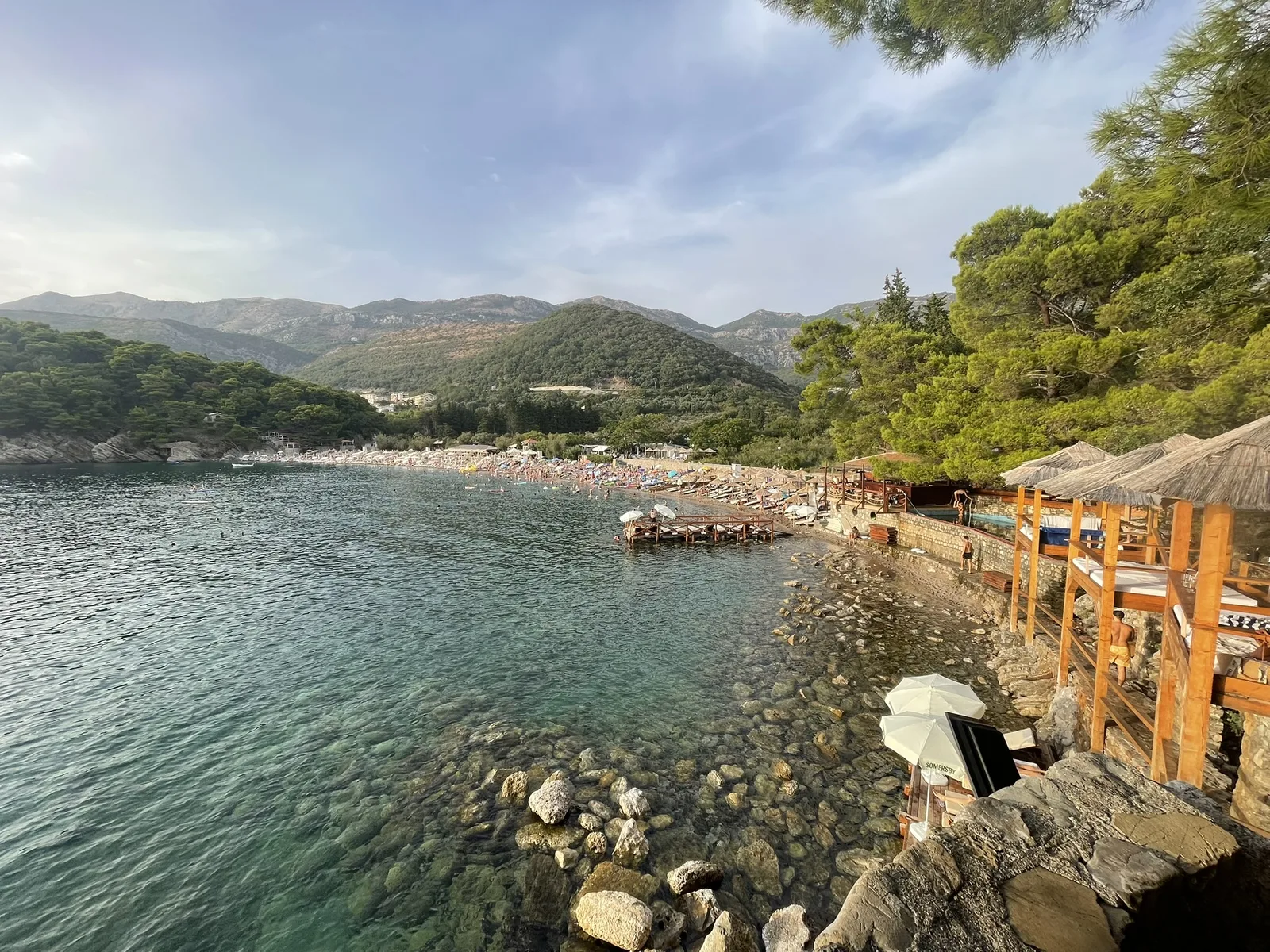The stone walkway above clear turquoise water at Lučice