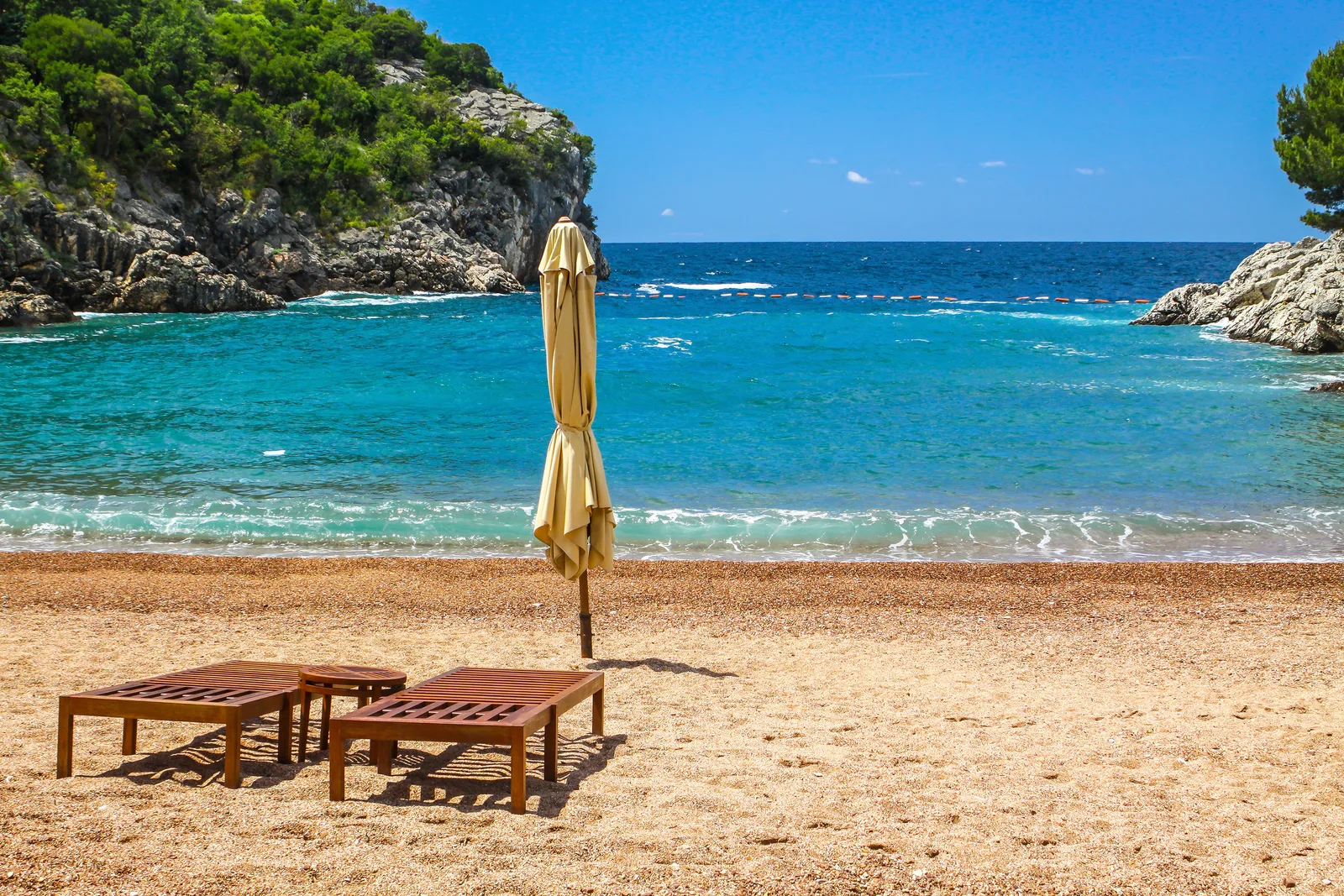 The secluded Queen's Beach (Kraljicina Plaza) cove at Milocer, with pink sand and turquoise water