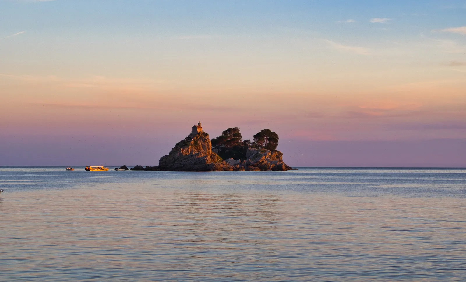 The rocky Katic islet and its little church off Petrovac at sunset