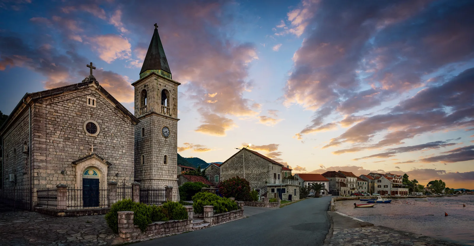 An old stone church at sunset in a seaside village near Tivat on the Bay of Kotor