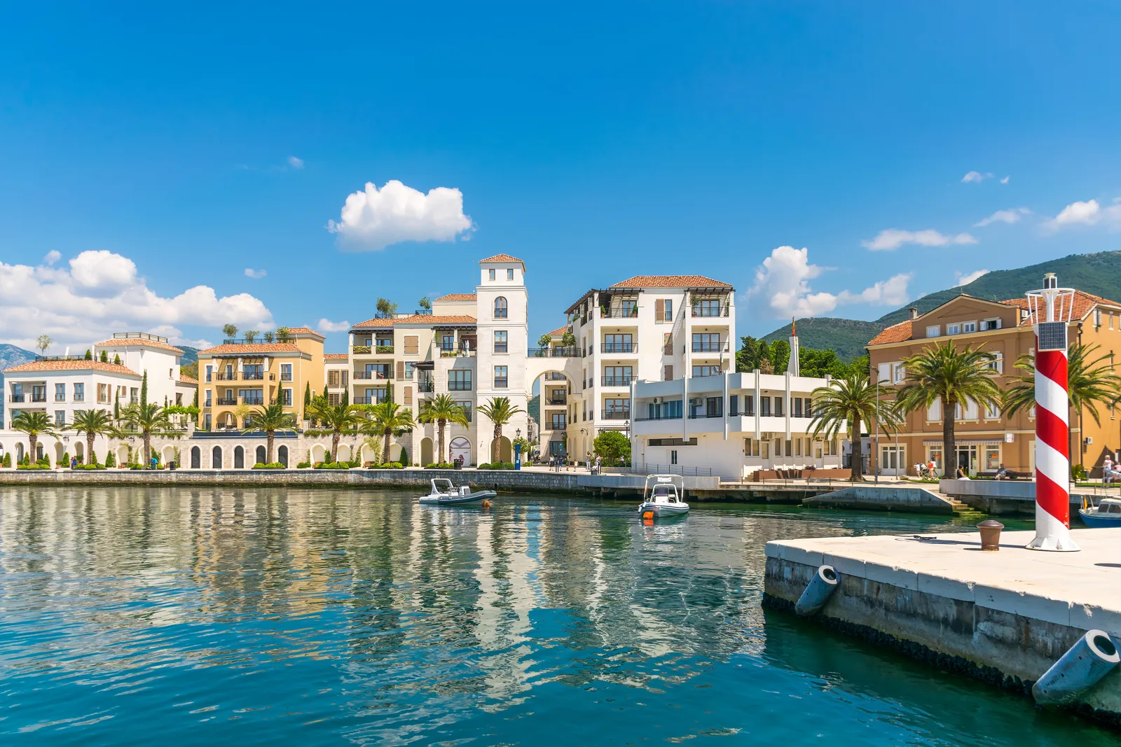 Venetian-style waterfront residences and a lighthouse at Porto Montenegro, Tivat