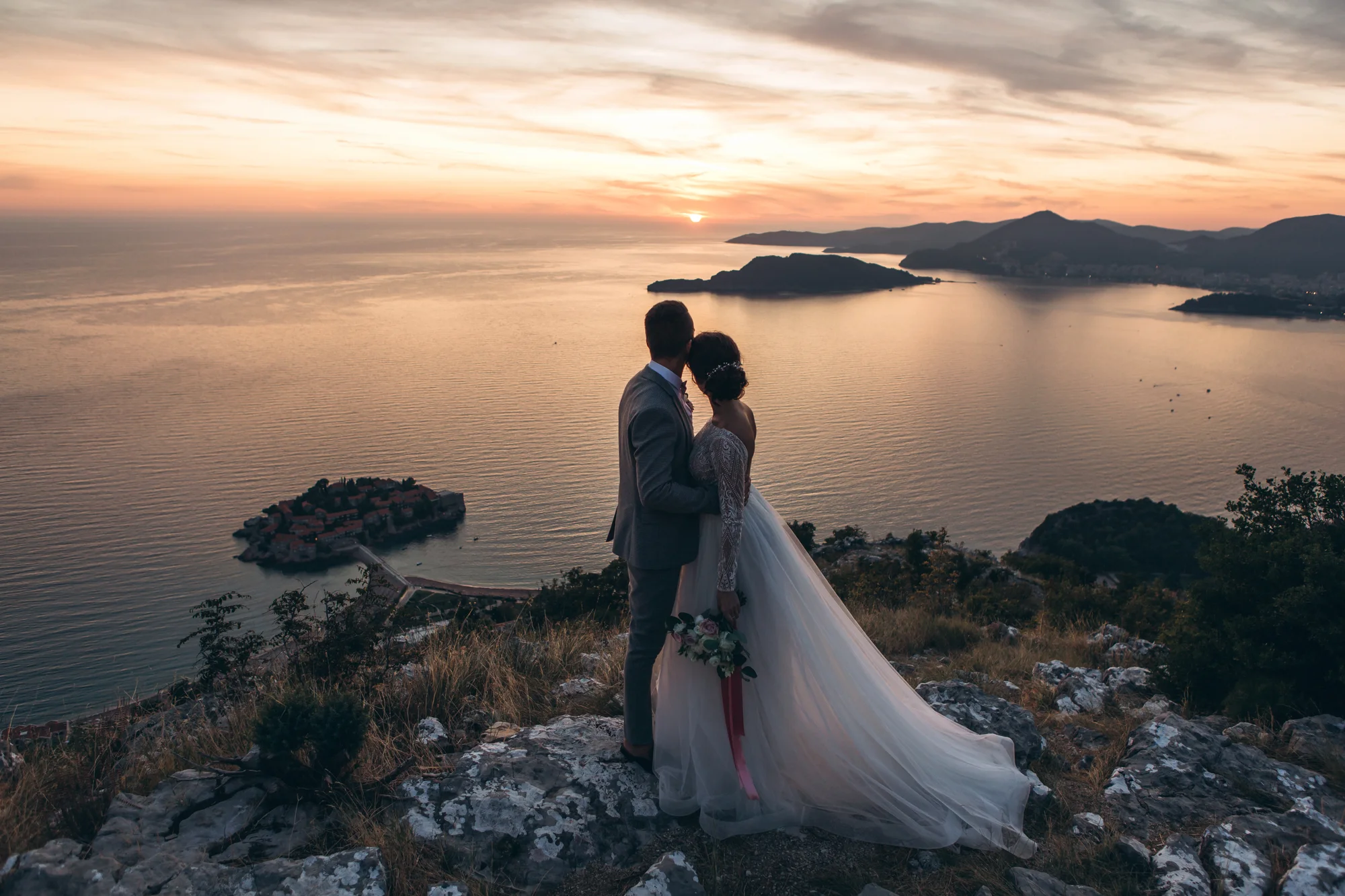 Wedding ceremony at sunset by a chapel in Montenegro